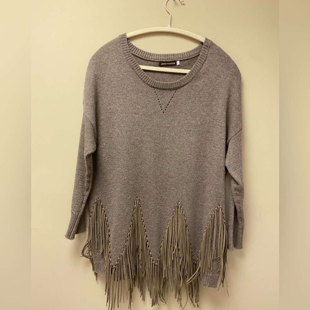 Very cool brown sweater with leather fringe on the bottom.